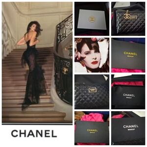 CHANEL Black Quilted Cosmetic Pouch with Gold Logo Charm